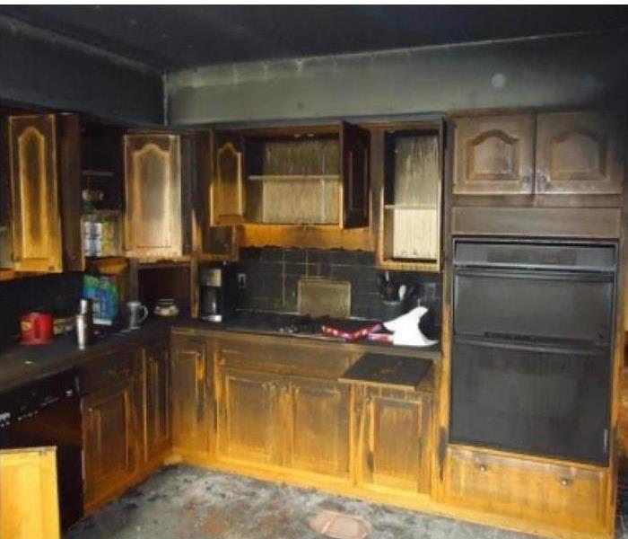 kitchen covered in soot damage