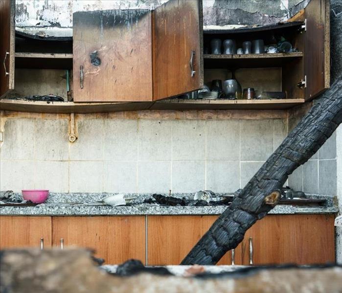 A kitchen that has been affected by a fire is pictured.